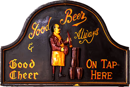 Vintage pub sign with a figure holding a beer bottle and text saying Good Beer & Good Cheer Always On Tap Here.